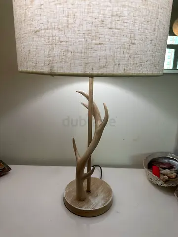 Beige textured table lamp with wooden antler-style stem