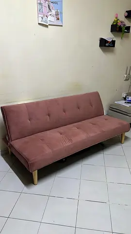 Compact pink convertible sofa bed - good condition