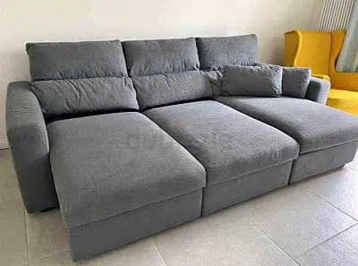 Dark gray Ikea Eskelstuna L shape sofa bed with storage