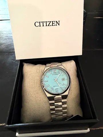 Citizen automatic men's stainless steel watch with turquoise dial