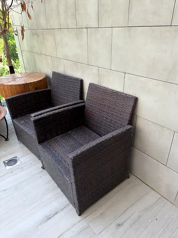 Outdoor rattan-style patio armchair with ottoman - good condition price go both