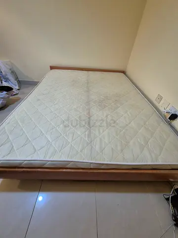 Queen size bed and mattress with simple wooden bed frame - good condition