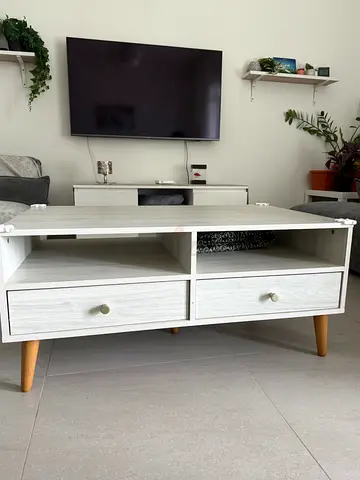 White wooden TV/coffee table with storage drawers