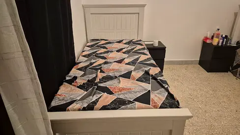 2 Single white wooden bed frames with 2 small cabinets - good condition. Matress is fair