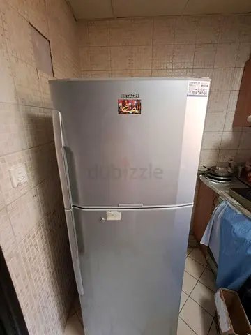 Silver double-door refrigerator - good working condition