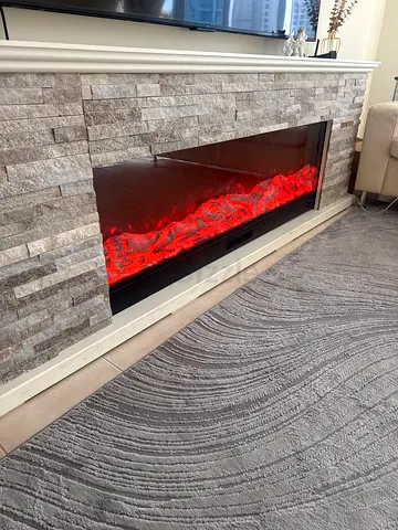 Built-in electric fireplace insert with stone surround - good condition