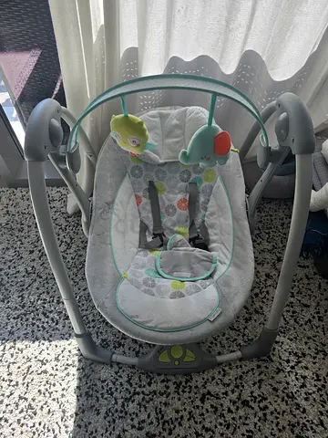 Baby electric swing with toy bar - gently used