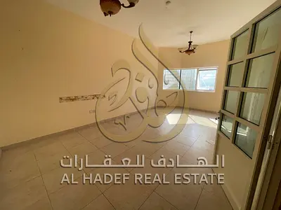 Two-bedroom apartment with a living room in Al Majaz 3, next to Al Safya Park. It features a spacious layout, a balcony with a sea view, a hallway, bu