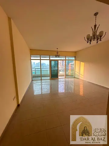 Two-bedroom apartment with a living room available for annual rent in Horizon Towers, Al Rashidiya (located above the Cooperative Society). It is situ