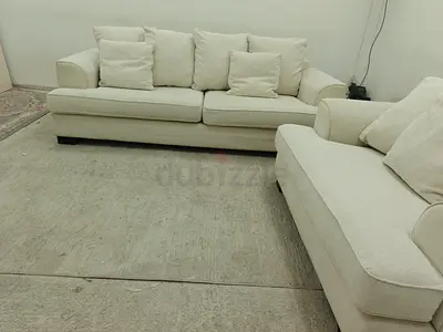 The one brand beige color 4 seater sofa