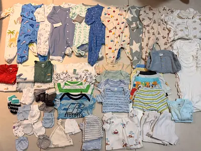 Large lot of newborn to 3-month baby clothes — sleepsuits, bodysuits, pants, hats