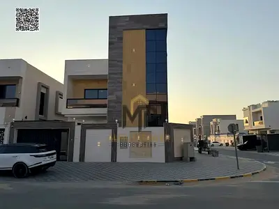Brand-new corner villa for sale in Al Amerah, Ajman. Features 5 master bedrooms, sophisticated desi