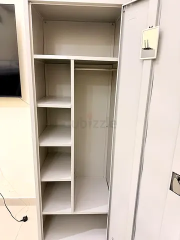 Light Gray built-in wardrobe with shelves and hanging space