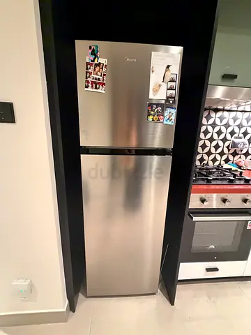 Medium stainless steel fridge-freezer in good working condition