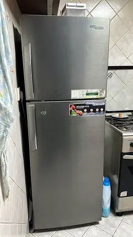 Grey double-door refrigerator, good working condition