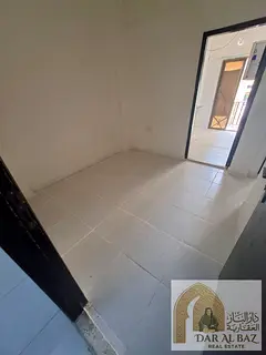 One-bedroom apartment with a living room for rent in Al Butina, Sharjah; includes a balcony and bath