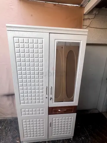 White freestanding wardrobe with mirror and drawer