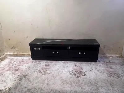 Low black TV cabinet with drawers - good condition