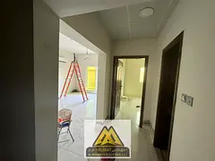 1BR apartment in Al Rawda 3, Ajman, with balcony and split AC. Prime location. AED 30K yearly, payab