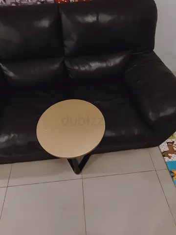 Small round side table - golden top with black base. Also selling exercise step stool along with it.