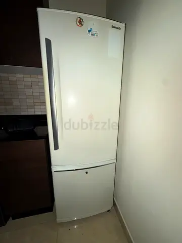 Used single-door refrigerator with bottom freezer - good condition