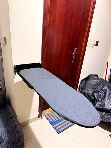 Foldable ironing board with adjustable height — good condition