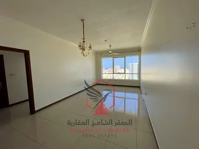 For rent in Al Qasimiya: A spacious one-bedroom apartment (bedroom + living room) with excellent finishing. Features easy access to Dubai. Includes on