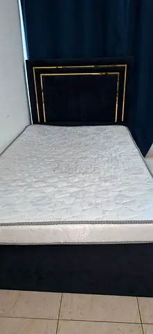 Single bed frame with mattress and padded headboard - dark velvet