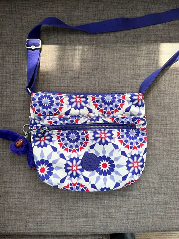 Kipling Small patterned crossbody Neil on water resistant bag with adjustable strap — blue/red/white