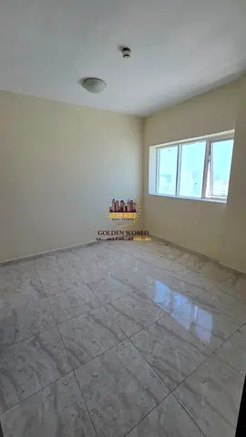 For Rent in Al Qasimia, Sharjah: A well-designed 2-bedroom apartment with a spacious living room, offering comfortable spaces and a practical layout
