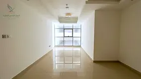 Premium 1BR apartment for annual rent with 2 baths central AC balcony wardrobes private parking gym