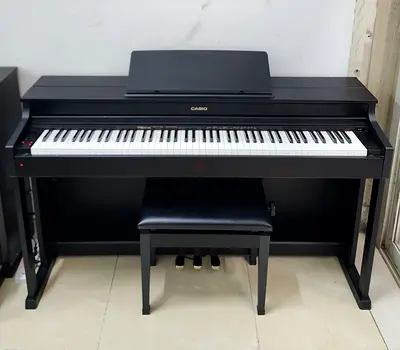 The Casio Celviano AP-470BK is an 88-key digital upright piano designed to emulate the touch and ton