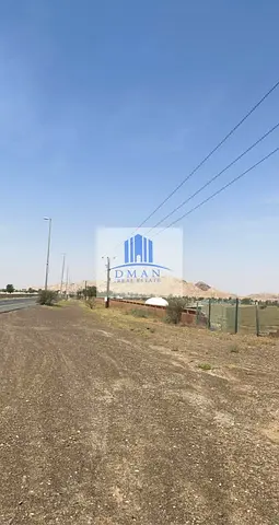 For sale, 4 commercial, residential, and agricultural lands in Al Madam, on a main street