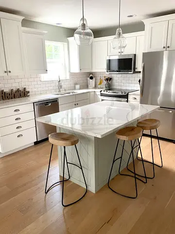 Modern kitchen island with white marble top