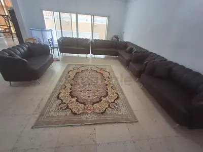 Large brown leather L-shaped 8 seat sofa set, mat/rug not included