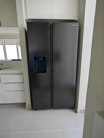 Samsung Side-by-Side Refrigerator with Water Dispenser - Good Condition