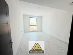 A spacious 2-bedroom apartment with a large living room is available for annual rent in Al Rawda 1, 