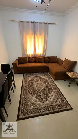 Furnished one-bedroom apartment with a living room for monthly rent – ​​Ajman Corniche.