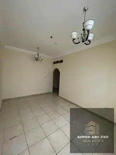 A two-bedroom apartment with a living room is available for annual rent in Sharjah, featuring a spac