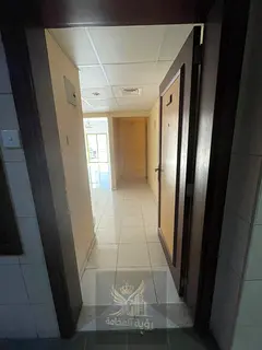 Spacious 2BR Apartment for Annual Rent in Abu Shagara Opposite a Mosque with Balcony & Built-in Ward