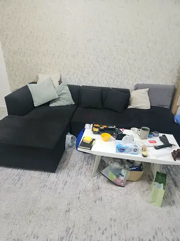 Dark grey L-shaped sectional sofa with chaise - good condition bran new bought 1800 hundred