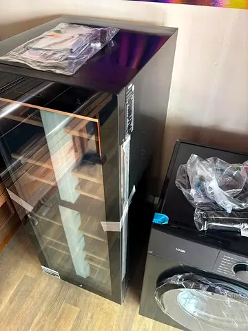 Tall wine cooler fridge with wooden shelves