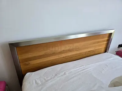 Steel bed frame with wood veneer headboard