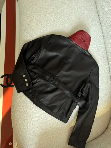Chanel Genuine black leather jacket with red collar, belted waist,