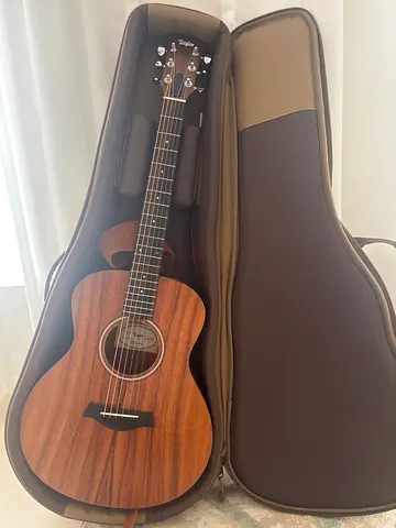 New Taylor GS Mini-e Koa Acoustic-Electric Guitar Bundle (Gig bag, Leather Strap, Strings & Picks)