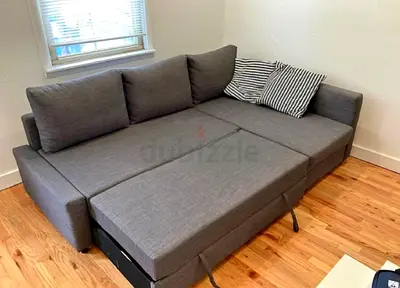 Gray L-shaped Sofa Bed with Pull-Out Mattress - Good Condition