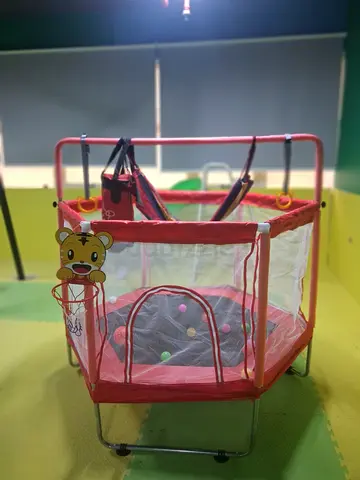Red Hexagonal Baby Playpen with Toys and Basketball Hoop - Good Condition