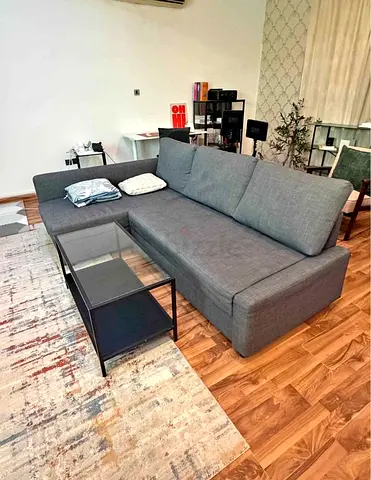 Grey L-shaped Sofa bed with Chaise - Good Condition