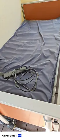 Used hospital/medical adjustable bed with air mattress and rails