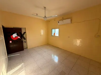 For Rent: 1 Bedroom Apartment with a closed living room, large spacious rooftop, air conditioning, and spacious areas. Prime location in Al Nuaimiya 2